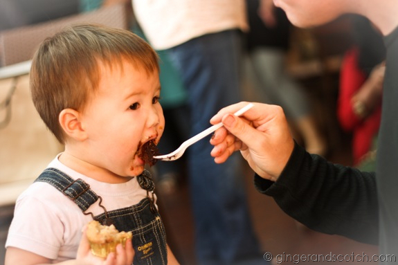 Dulce de Leche cupcake in one hand and being fed chocolate by Dad? A toddler's dream!