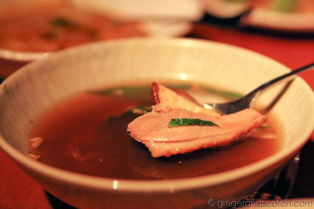 Clear soup of roast duck with thai basil and young coconut Clear soup of roast duck with thai basil and young coconut