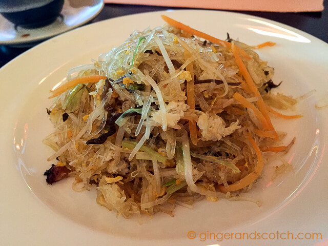 Wok-fried glass noodles with egg, mixed vegetables, mushrooms, and crab meat