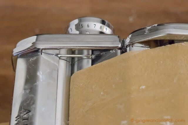 Kneading Chinese egg noodle dough with Marcato pasta machine until thickness level 6