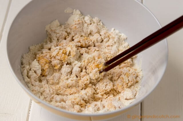 Mixing flour and eggs for homemade Chinese egg noodles
